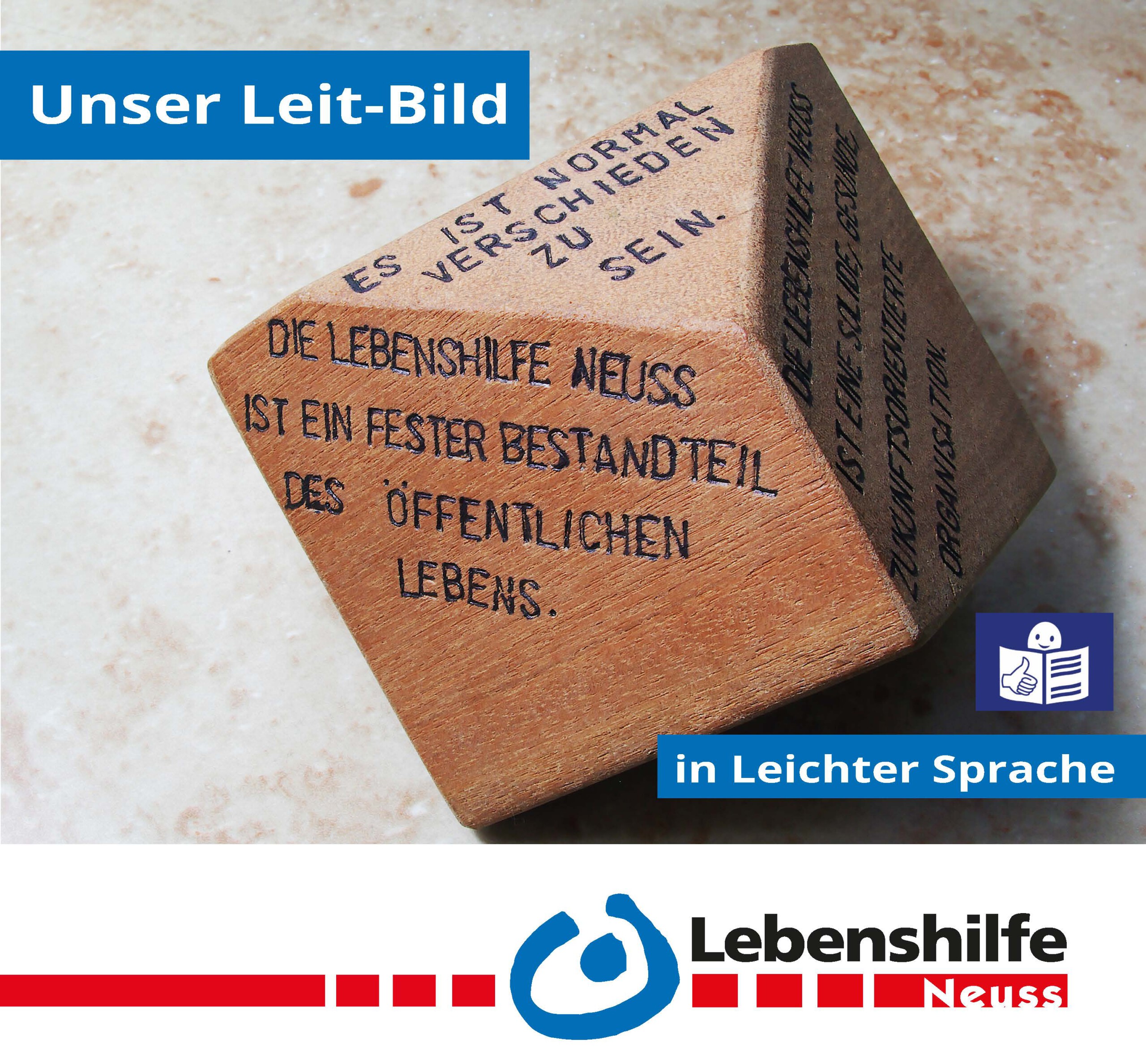 Titelbild vom Leitbild-Flyer in Leichter Sprache der Lebenshilfe Neuss. Darauf ein Foto eines siebenseitigen Würfels aus Holz. Auf den Seiten des Würfels stehen die wichtigsten Punkte des Leitbildes der Lebenshilfe Neuss.